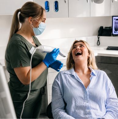 Dentist using digital scanner for same-day crowns in Pittsburgh